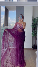 Partywear purple sequinned saree