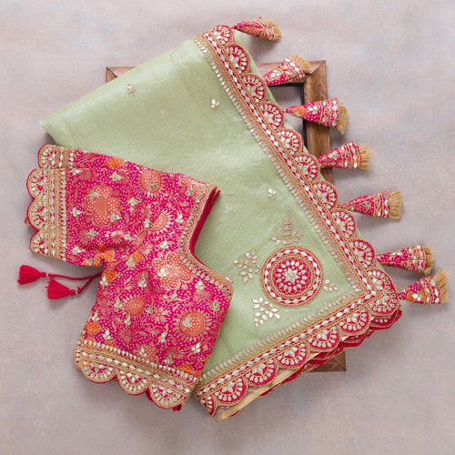 Pastel organza saree with gotta work lace