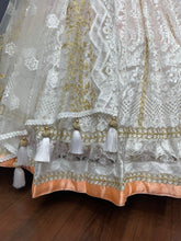 Bollywood inspired white and orange Lehenga