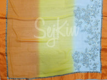Yellow, orange and white saree