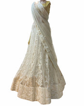 Luxury white lehenga with gold sequins
