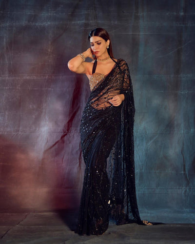 Partywear black net saree with sequins