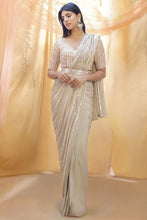 Celebrity style - ivory gold sequins saree
