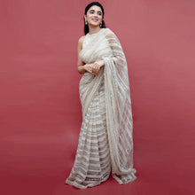 Off white net sequins embroidered saree