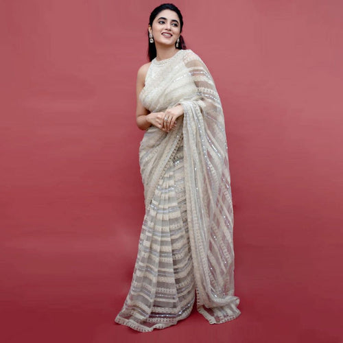 Off white net sequins embroidered saree