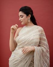 Off white net sequins embroidered saree