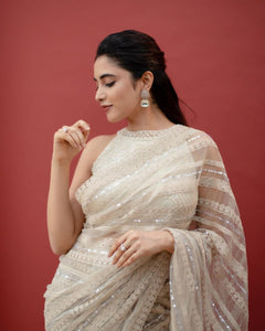 Off white net sequins embroidered saree